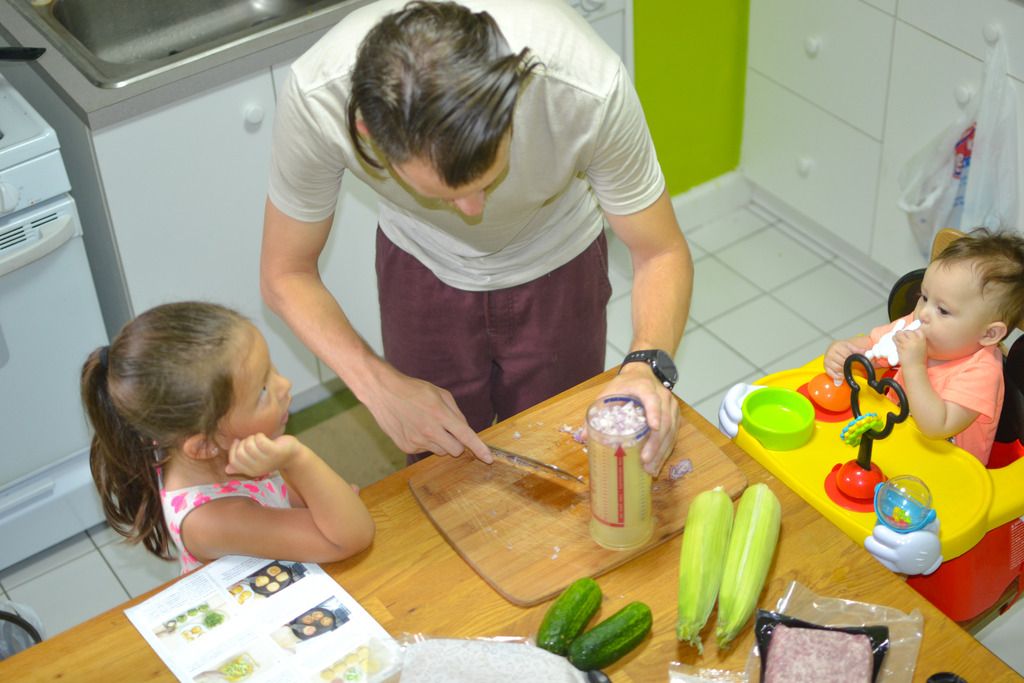 father and daughter cooking